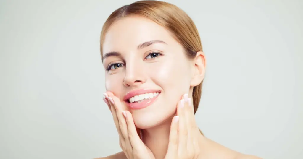 Woman showing smoother skin after laser treatment to reduce wrinkles in Highland, MD.